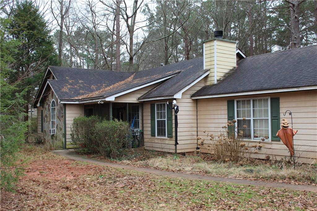 52 Standing Rock Road Senoia, GA 30276 - Photo 1 of 1 a front view of a house with garden