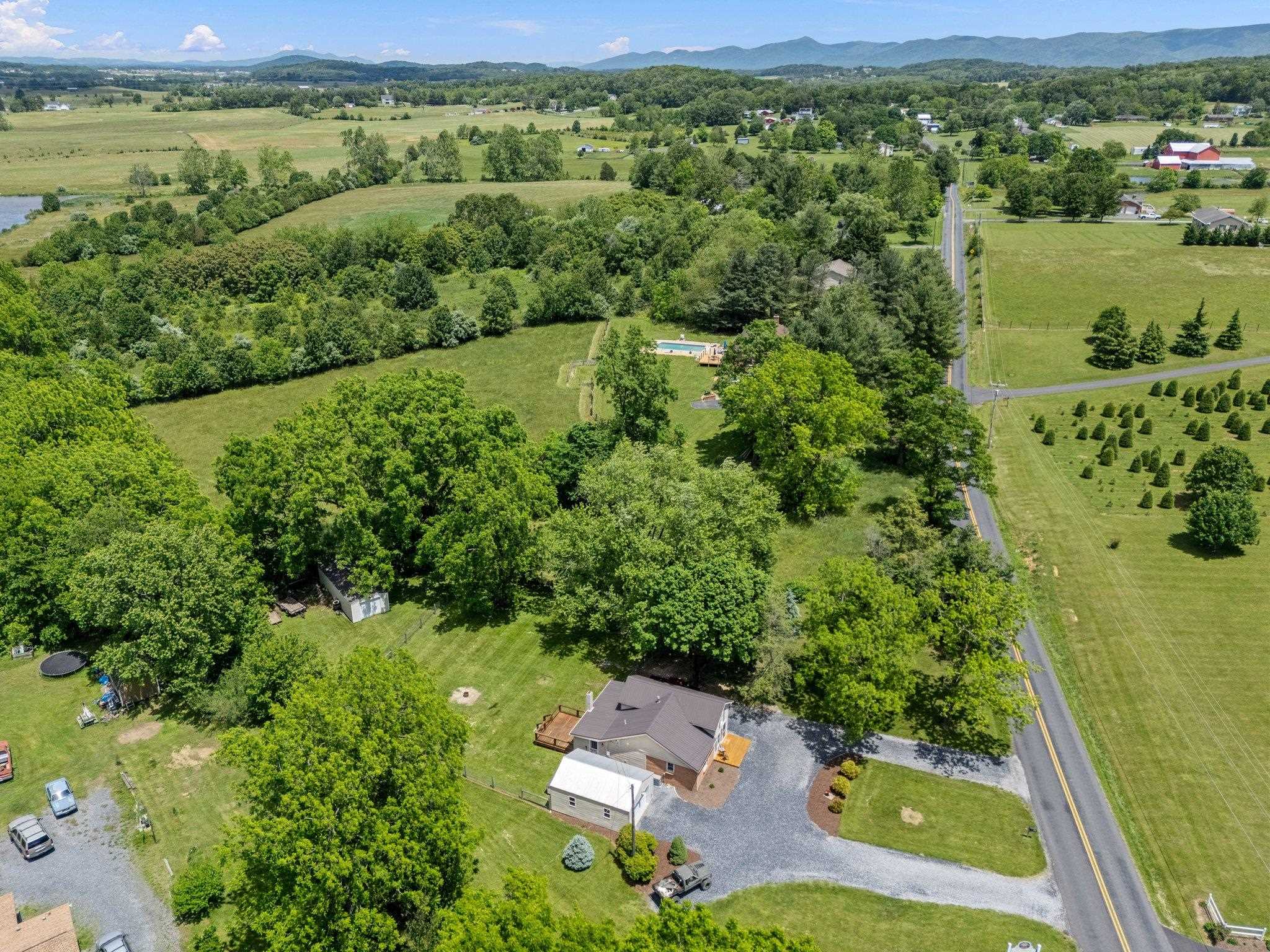 388 Kiddsville Road Fishersville, VA 22939 - Photo 41 of 50 a view of a lake with a houses