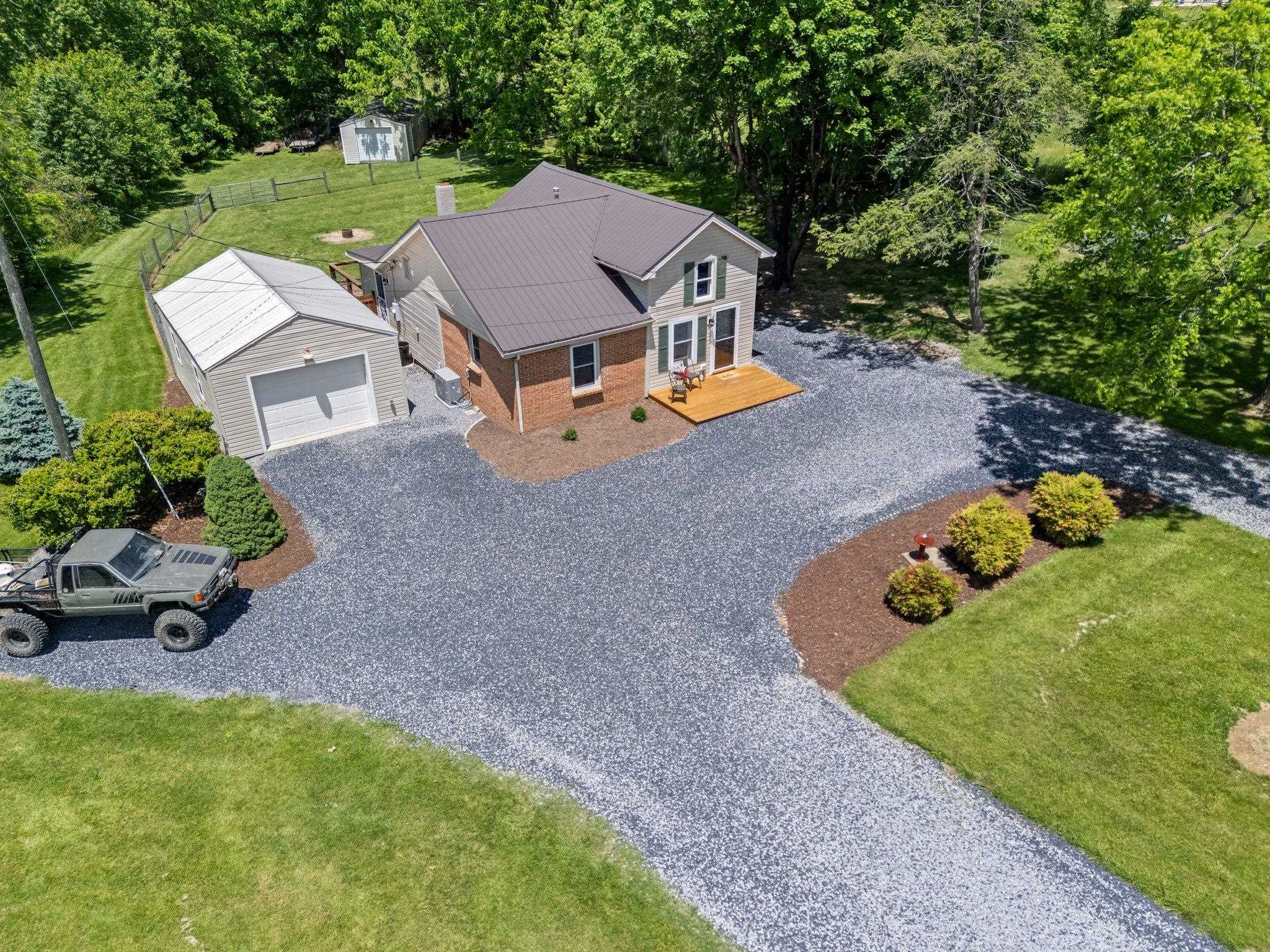 388 Kiddsville Road Fishersville, VA 22939 - Photo 46 of 50 an aerial view of a house with garden space and street view