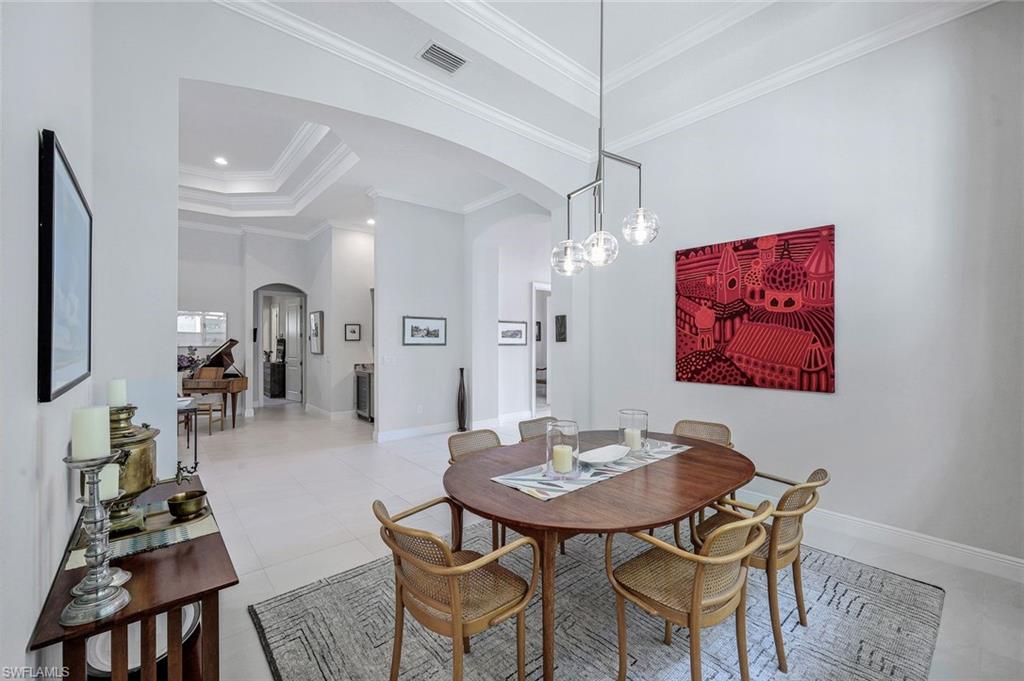 12762 Dundee Lane Naples, FL 34120 - Photo 13 of 35 a dining room with furniture and window