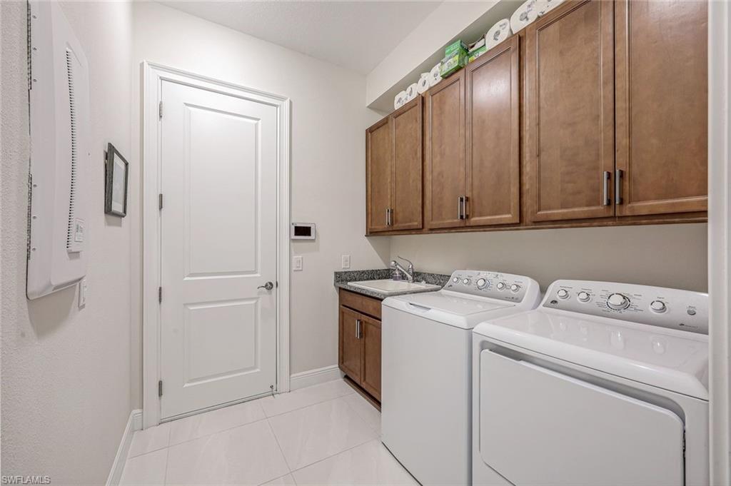 12762 Dundee Lane Naples, FL 34120 - Photo 26 of 35 a utility room with dryer and washer