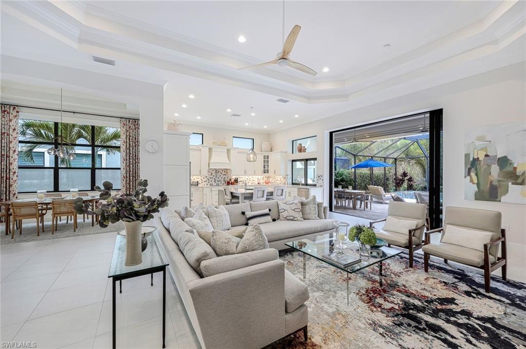 12762 Dundee Lane Naples, FL 34120 - Photo 3 of 35 a living room with furniture and a large window