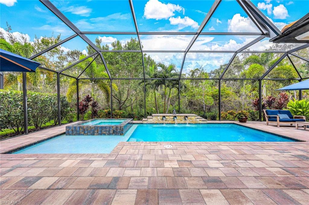 12762 Dundee Lane Naples, FL 34120 - Photo 31 of 35 a view of swimming pool with yard and tree in the background