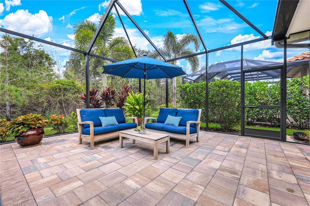 12762 Dundee Lane Naples, FL 34120 - Photo 33 of 35 a view of a backyard with sitting area and furniture