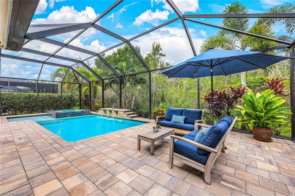 12762 Dundee Lane Naples, FL 34120 - Photo 34 of 35 a view of a backyard with sitting area and furniture