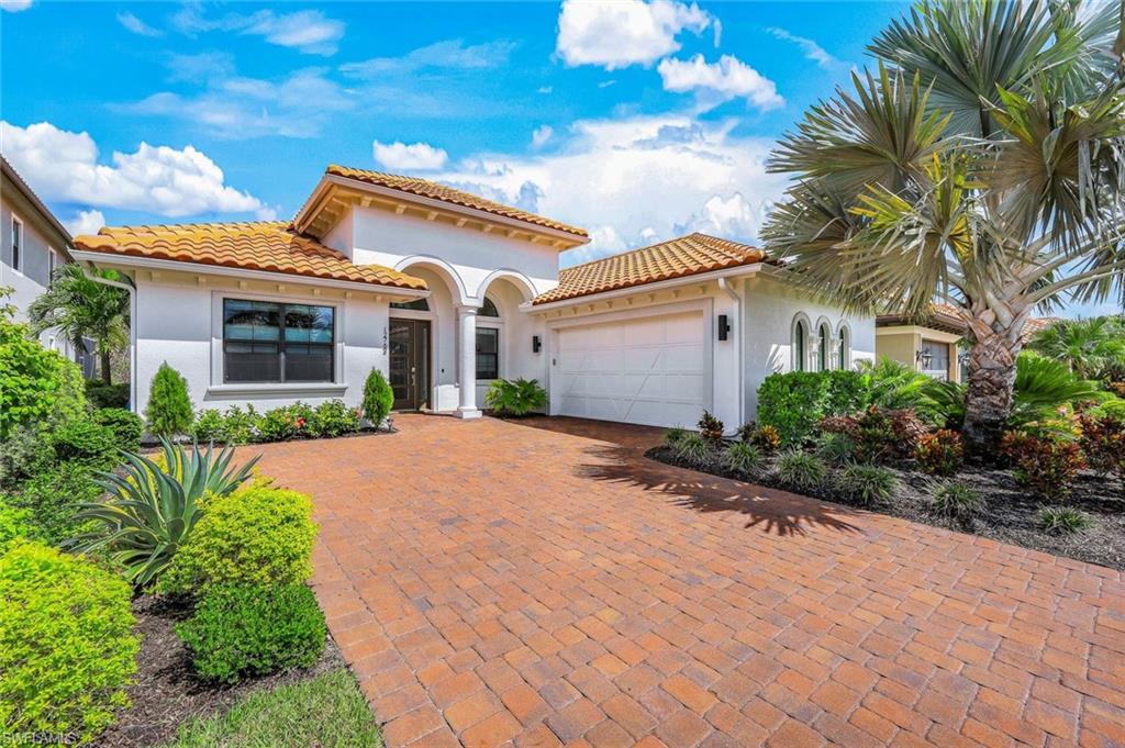 12762 Dundee Lane Naples, FL 34120 - Photo 35 of 35 a front view of a house with garden