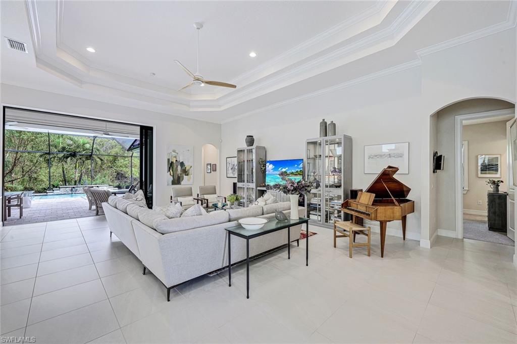 12762 Dundee Lane Naples, FL 34120 - Photo 6 of 35 a living room with furniture and a large window