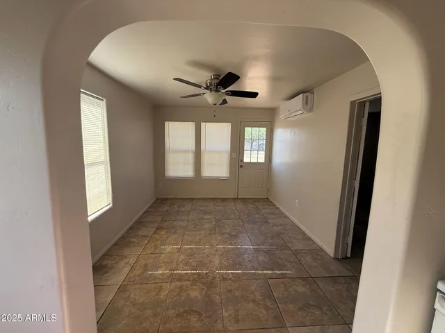 a view of an empty room and window