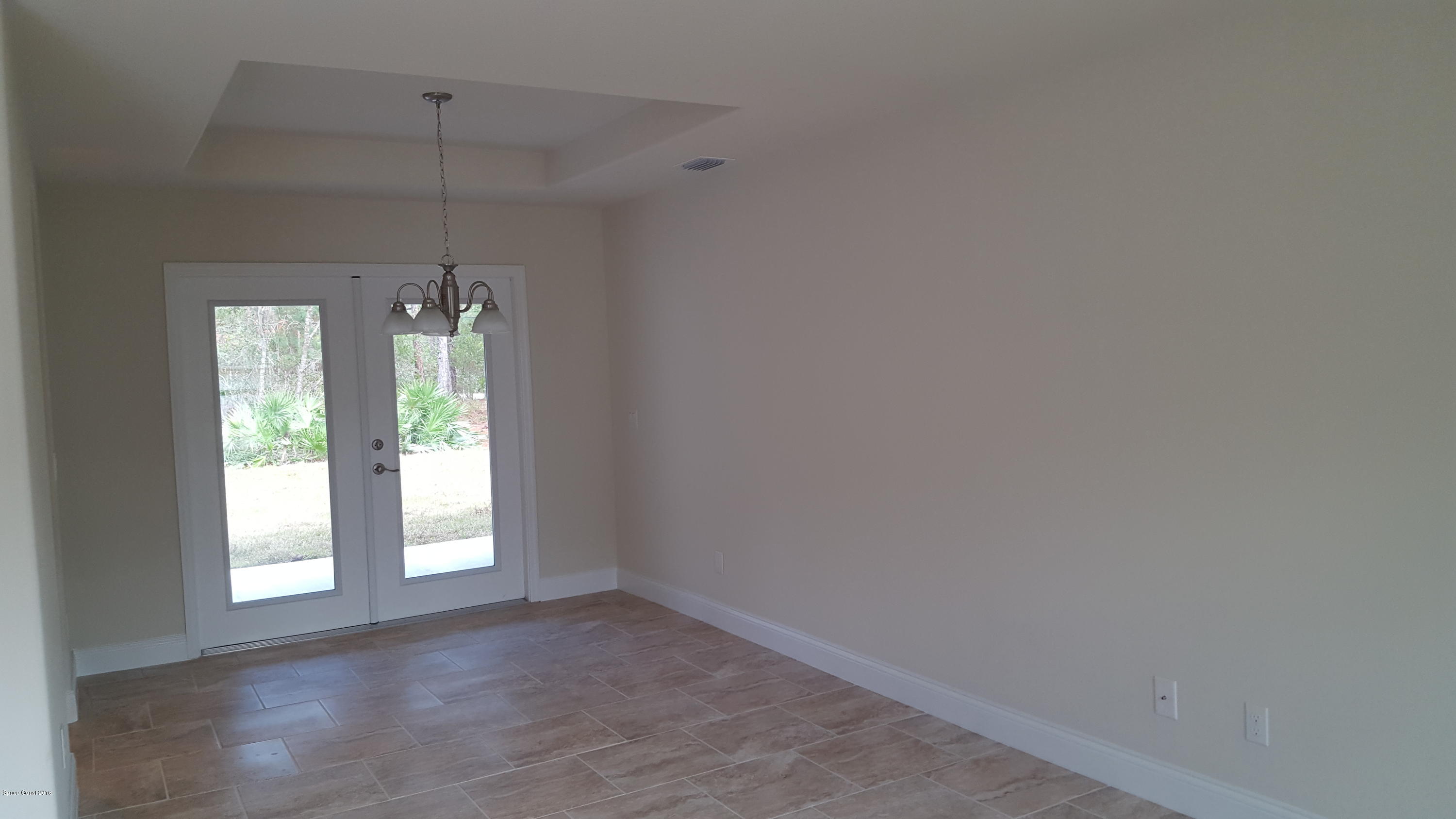 1111 Commerce Road Southeast Palm Bay, FL 32909 - Photo 2 of 12 Dining Room