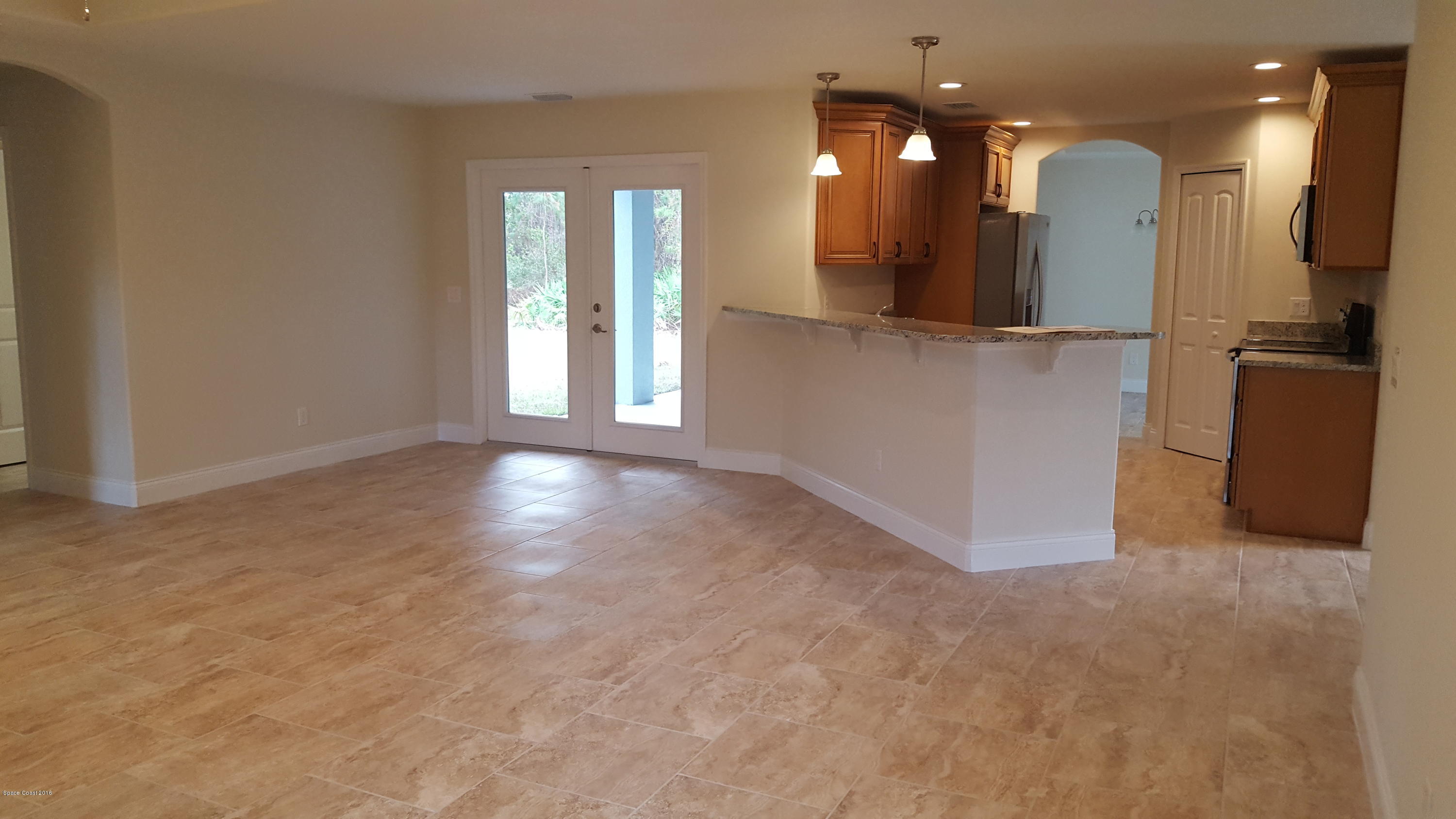 1111 Commerce Road Southeast Palm Bay, FL 32909 - Photo 3 of 12 Kitchen Open To Large Family Room