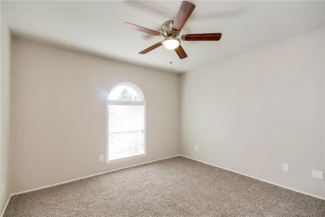 a bathroom with a sink and mirror with toilet