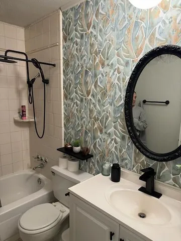 a view of a yard covered with snow in front of house