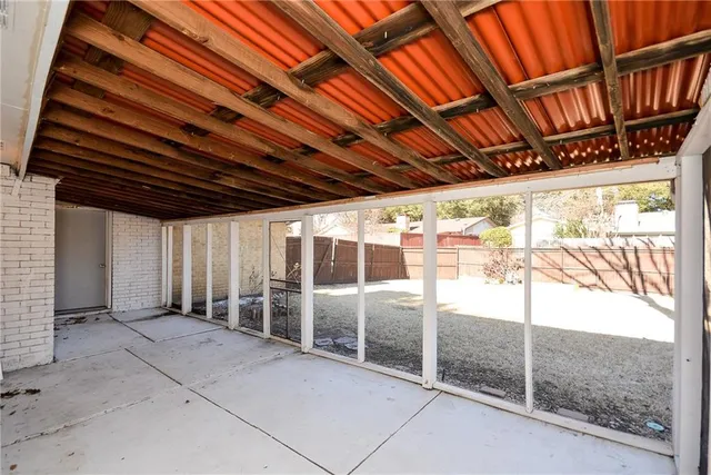 a street view with large trees