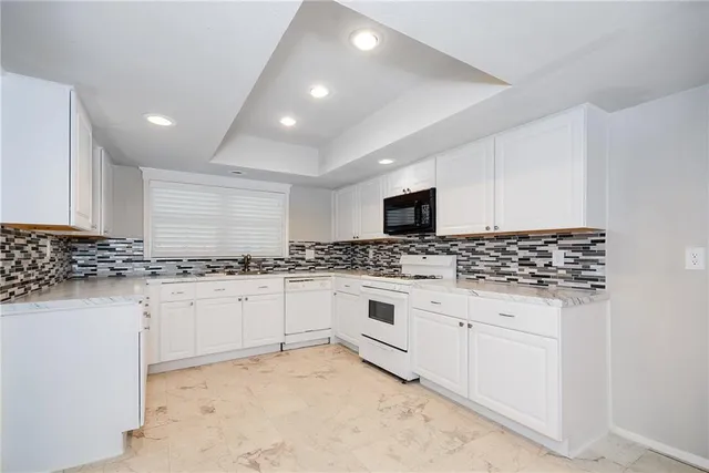 a kitchen with a stove and a sink