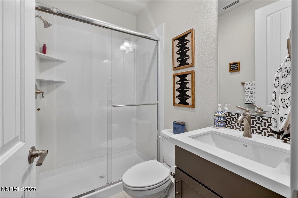 1640 Buttonwillow Street Minden, NV 89423 - Photo 19 of 39 a bathroom with a toilet sink and shower