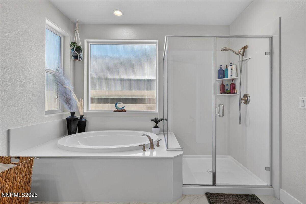 1640 Buttonwillow Street Minden, NV 89423 - Photo 24 of 39 a bathroom with a tub and a shower