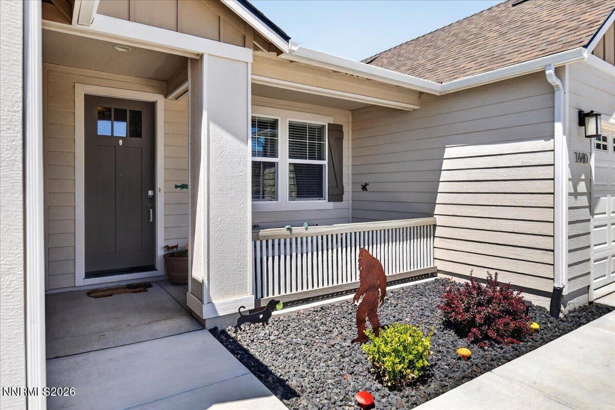 1640 Buttonwillow Street Minden, NV 89423 - Photo 3 of 39 a front view of a house with a garden