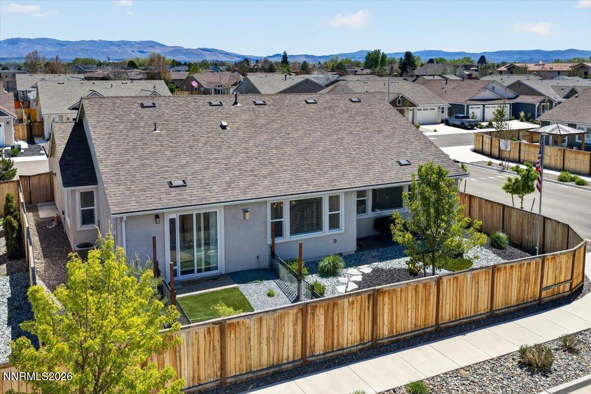 1640 Buttonwillow Street Minden, NV 89423 - Photo 35 of 39 a view of a house with a yard and potted plants