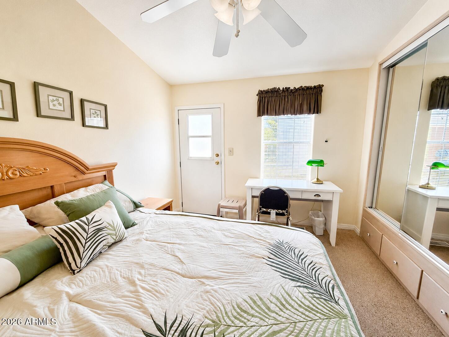 8865 East Baseline Road, Unit 103 Mesa, AZ 85209 - Photo 24 of 47 a bedroom with a bed and wooden floor