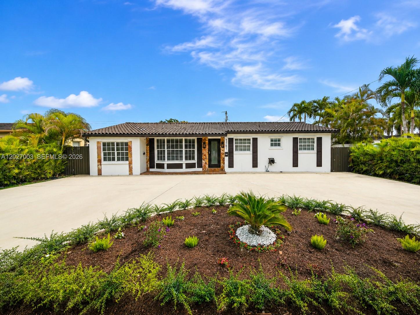 2761 Southwest 92nd Place Miami, FL 33165 - Photo 23 of 37 a view of a house with a yard