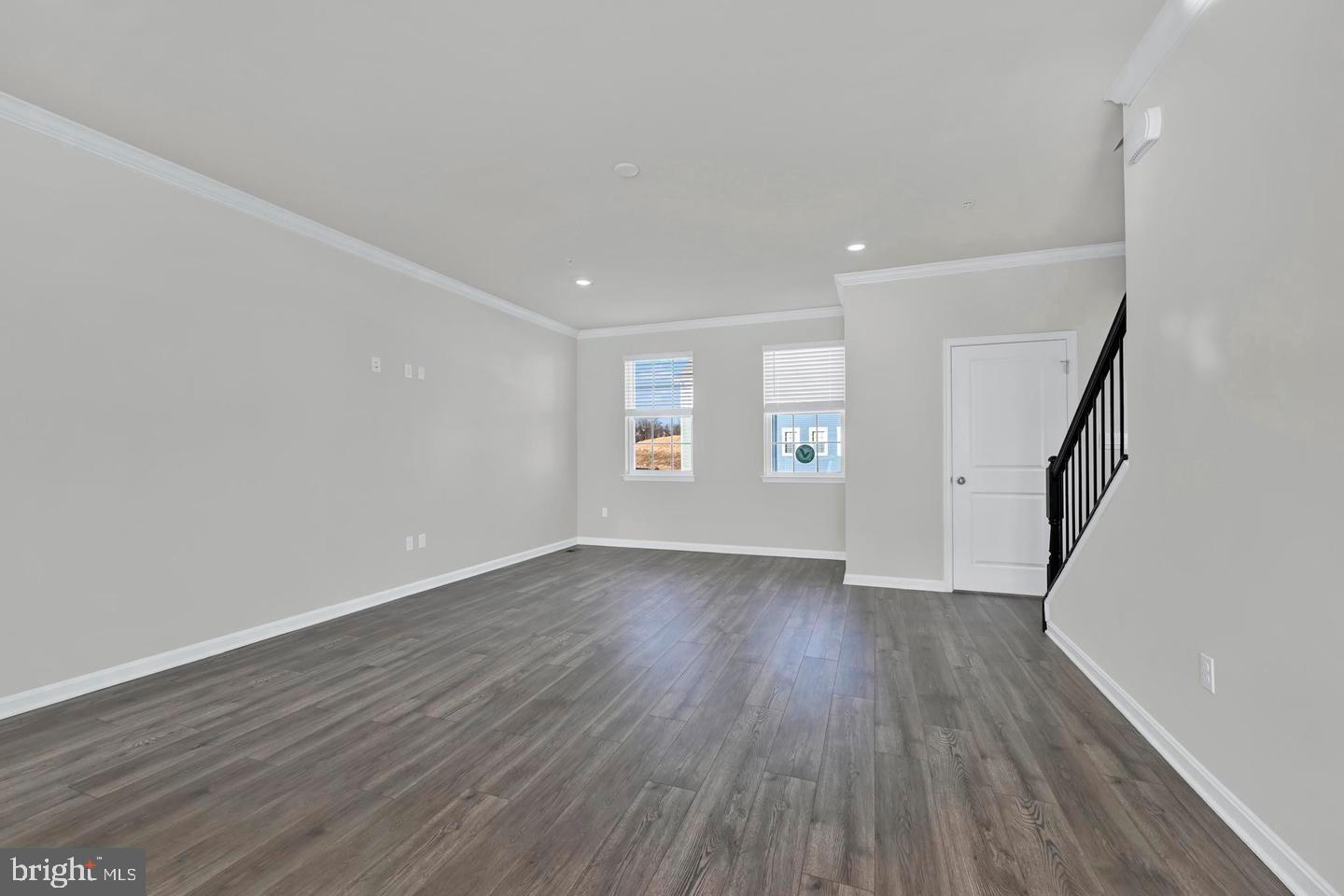 5030 Silver Oak Drive Rosedale, MD 21237 - Photo 2 of 3 wooden floor in an empty room with a window