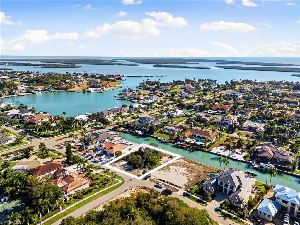 1675 Ludlow Road Marco Island, FL 34145 - Photo 11 of 14 Aerial view of property's location with nearby suburban area and a nearby body of water