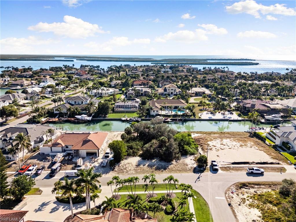 1675 Ludlow Road Marco Island, FL 34145 - Photo 13 of 14 Aerial view of property's location with nearby suburban area and a nearby body of water