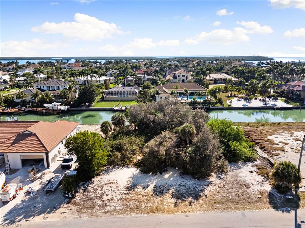 1675 Ludlow Road Marco Island, FL 34145 - Photo 14 of 14 Aerial perspective of suburban area featuring a large body of water