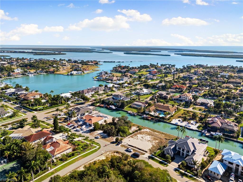1675 Ludlow Road Marco Island, FL 34145 - Photo 3 of 14 Aerial view of property's location featuring nearby suburban area and a nearby body of water