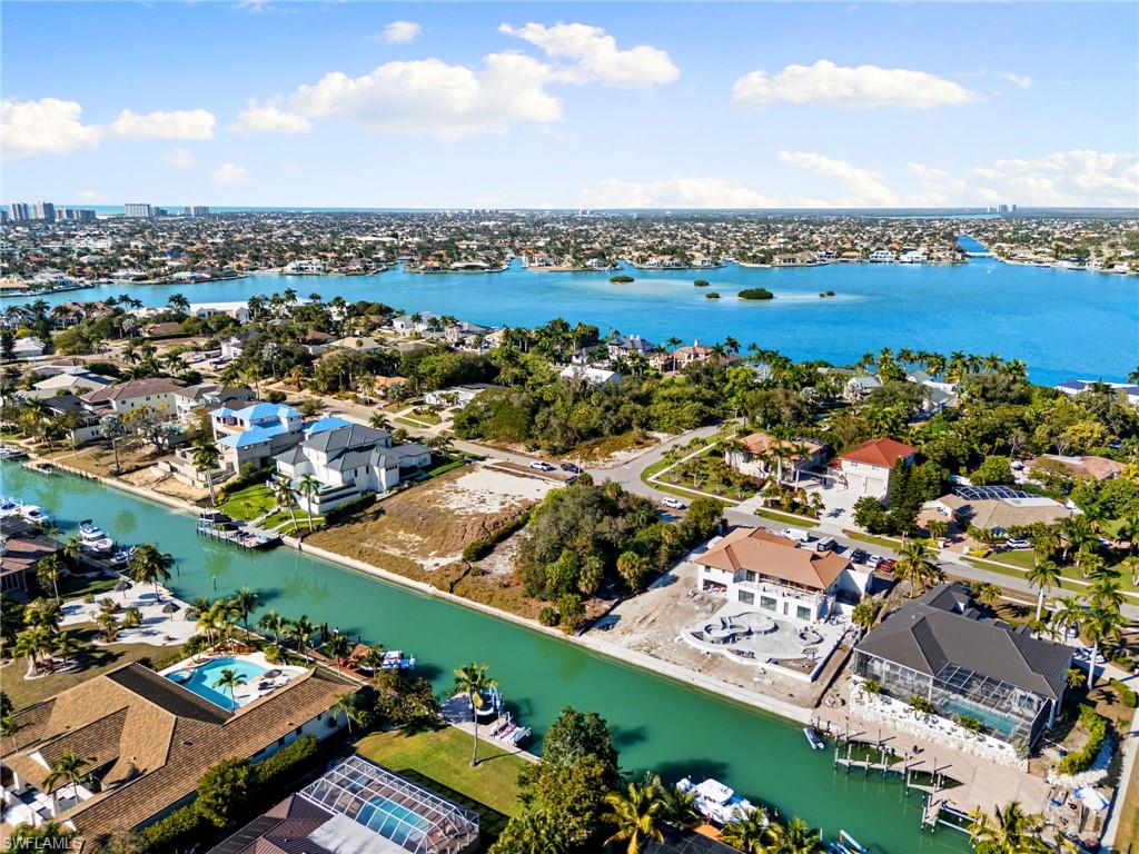 1675 Ludlow Road Marco Island, FL 34145 - Photo 7 of 14 Aerial view of residential area with a large body of water