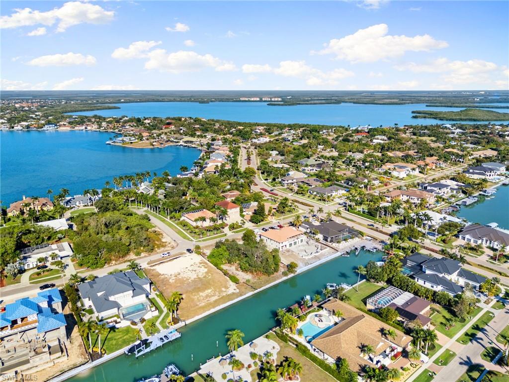 1675 Ludlow Road Marco Island, FL 34145 - Photo 9 of 14 Aerial view of residential area with a nearby body of water