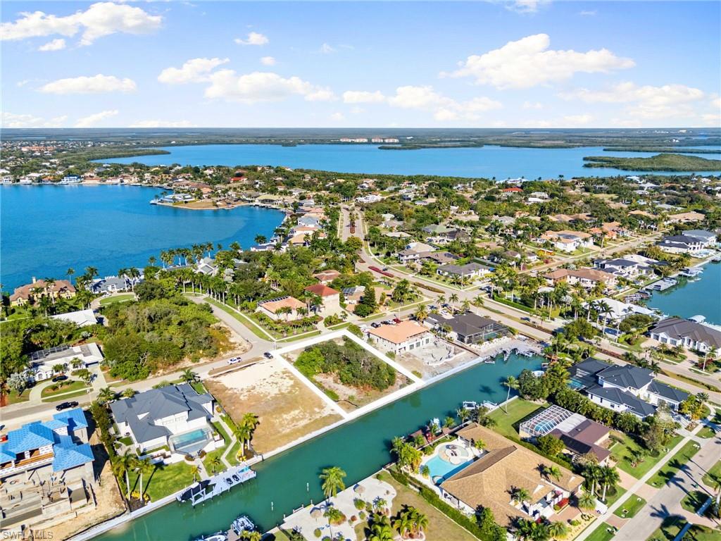 1675 Ludlow Road Marco Island, FL 34145 - Photo 10 of 14 Aerial perspective of suburban area with a nearby body of water