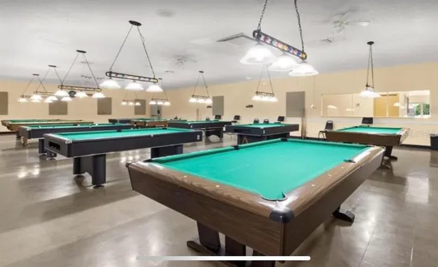 a view of a swimming pool with a yard