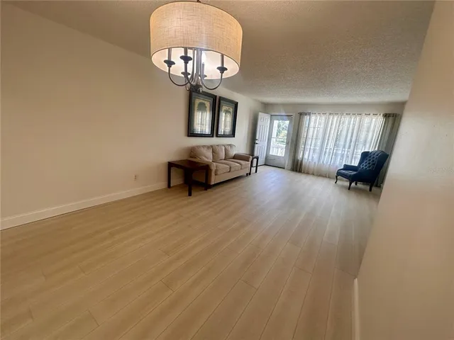 a view of a livingroom with furniture and a chair