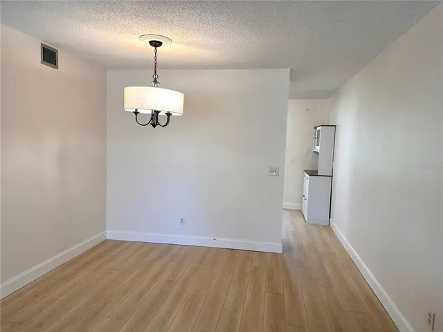 a view of a livingroom with furniture and wooden floor