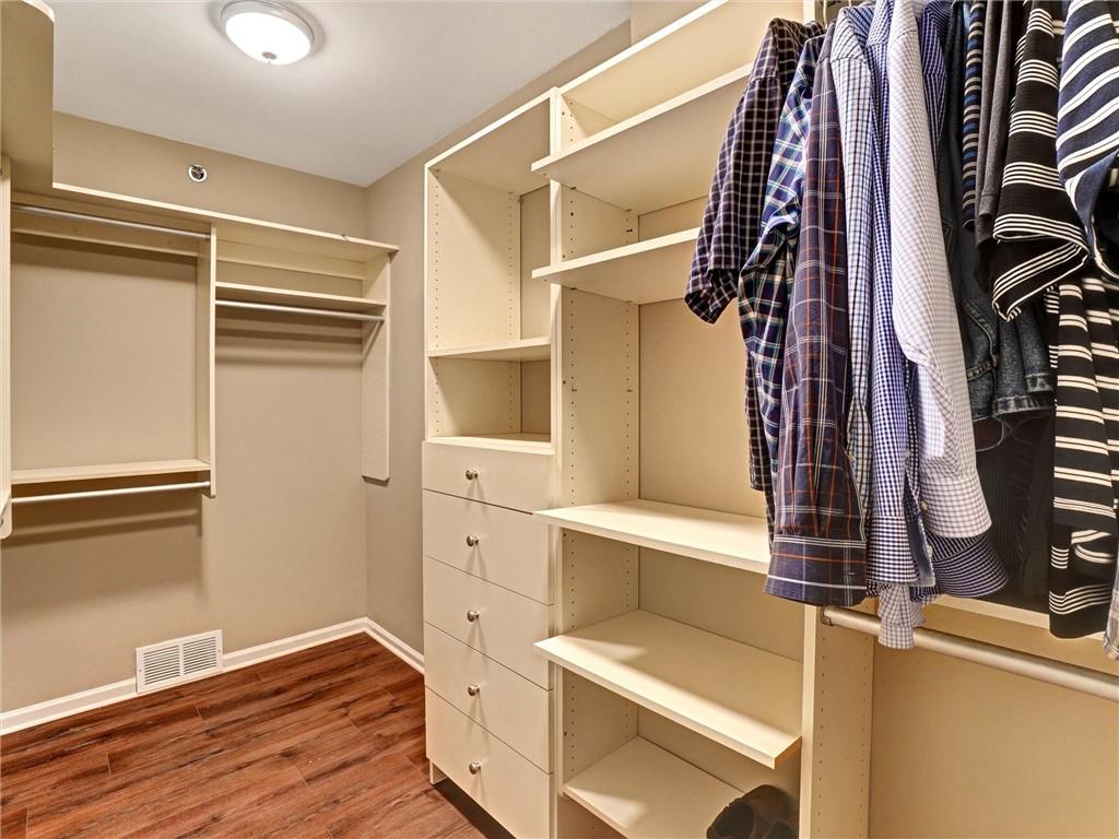 3435 Kingsboro Road Northeast, Unit 1601 Atlanta, GA 30326 - Photo 17 of 54 a view of walk in closet with clothes and shoes