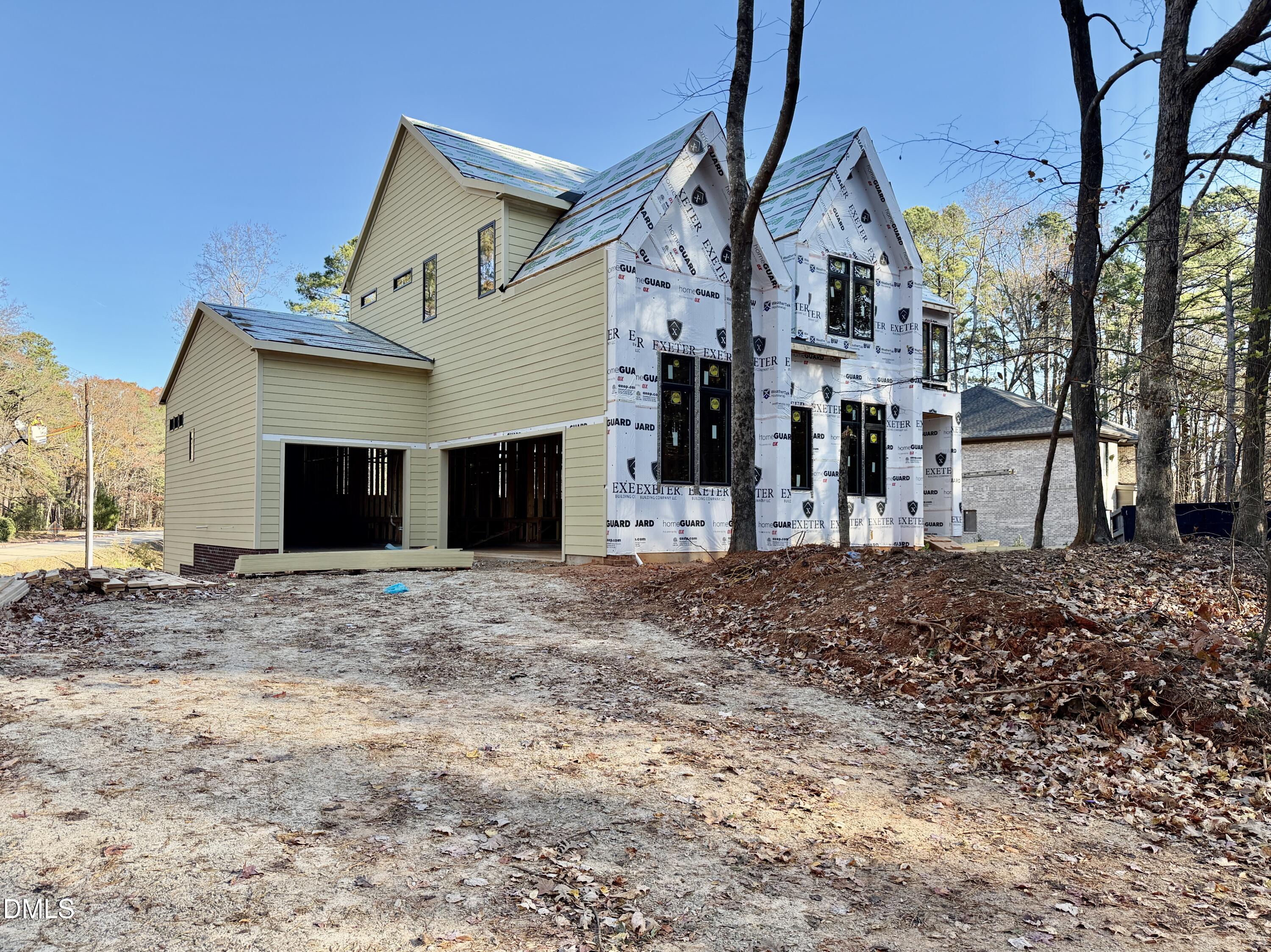 2332 Windy Woods Drive Raleigh, NC 27607 - Photo 4 of 9 a front view of a house with a yard