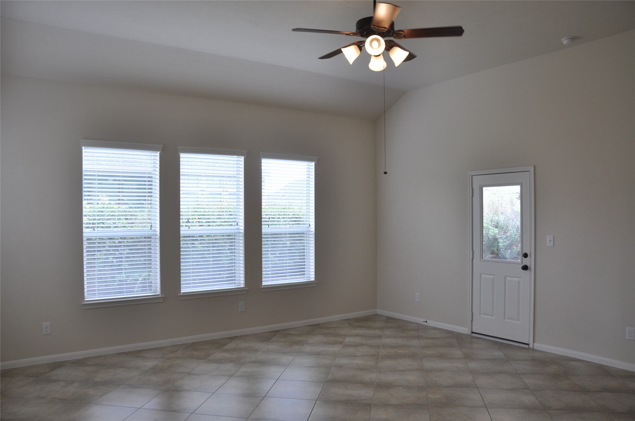 8161 Tranquil Lake Way Conroe, TX 77385 - Photo 15 of 20 a view of an empty room with a window