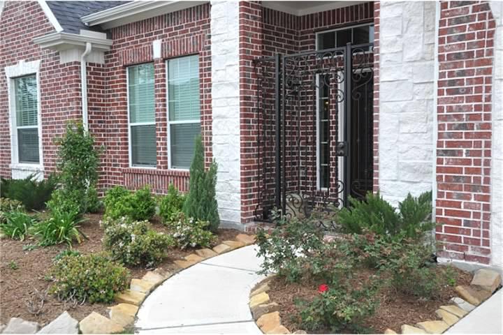 8161 Tranquil Lake Way Conroe, TX 77385 - Photo 3 of 20 a view of a backyard with plants