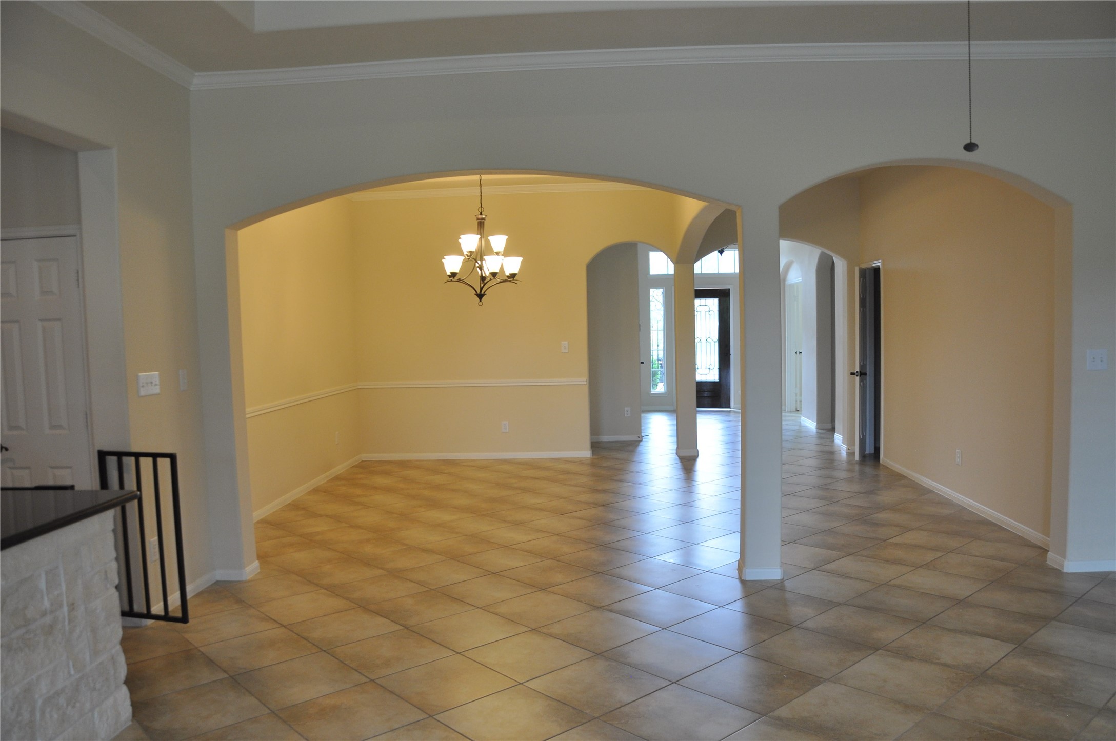 8161 Tranquil Lake Way Conroe, TX 77385 - Photo 8 of 20 a view of hall with a chandelier
