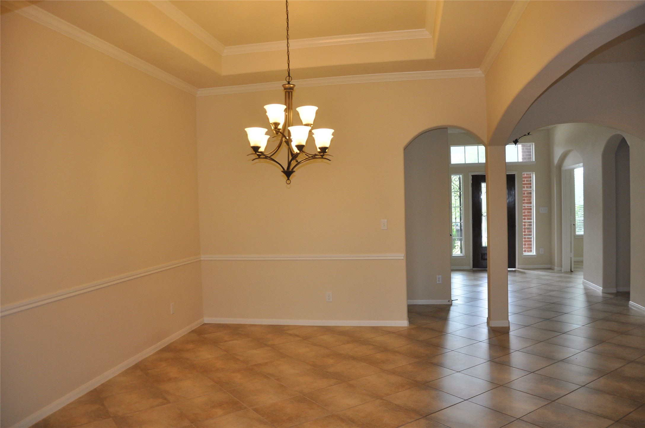 8161 Tranquil Lake Way Conroe, TX 77385 - Photo 9 of 20 a view of a hallway with a chandelier