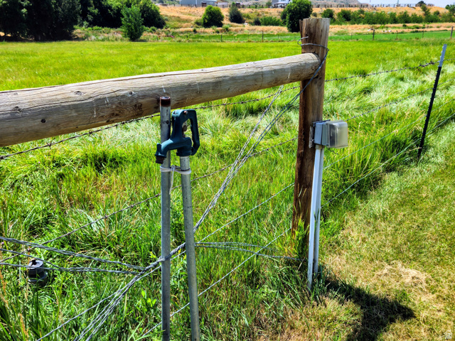 802 East 3200 Road North Preston, ID 83263 - Photo 12 of 59 Fenced perimeter with a prominent wooden post and crossbeam