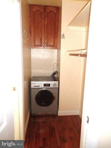 a view of a storage and utility room with washer and dryer