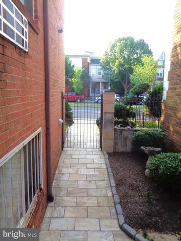 a view of a pathway with a patio