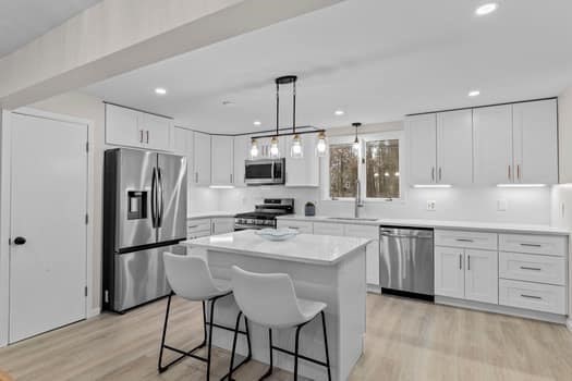 221 Plain Street Hanover, MA 02339 - Photo 11 of 29 a kitchen with stainless steel appliances granite countertop a refrigerator a sink dishwasher a stove and white cabinets with wooden floor