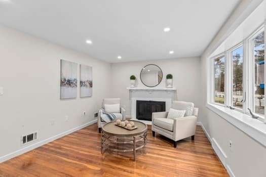 221 Plain Street Hanover, MA 02339 - Photo 17 of 29 a living room with furniture and a fireplace