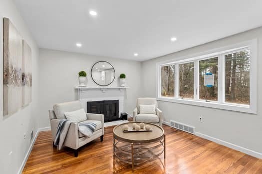 221 Plain Street Hanover, MA 02339 - Photo 18 of 29 a living room with furniture a fireplace and a window