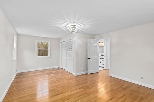 221 Plain Street Hanover, MA 02339 - Photo 24 of 29 wooden floor in an empty room with a window