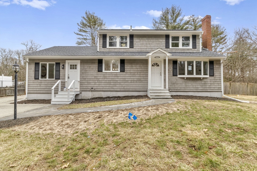 221 Plain Street Hanover, MA 02339 - Photo 29 of 29 a front view of a house with a yard