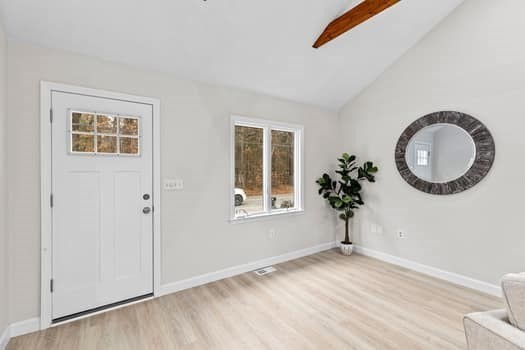221 Plain Street Hanover, MA 02339 - Photo 4 of 29 a view of a bedroom with a window and a mirror